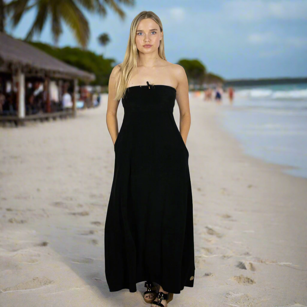 Stay cool and elegant with black long towel dress. Soft towelling, quick-drying, and designed for effortless style for at home, beach, bar or boat. Deep pockets and bust support.