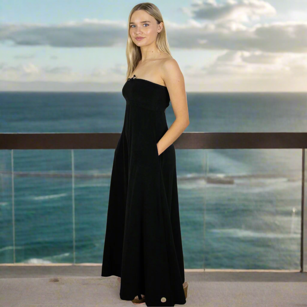 Elegant black long towel dress. - side view Soft towelling, quick-drying, and designed for effortless style for at home, beach, bar, hotel or boat. Deep pockets and bust support.