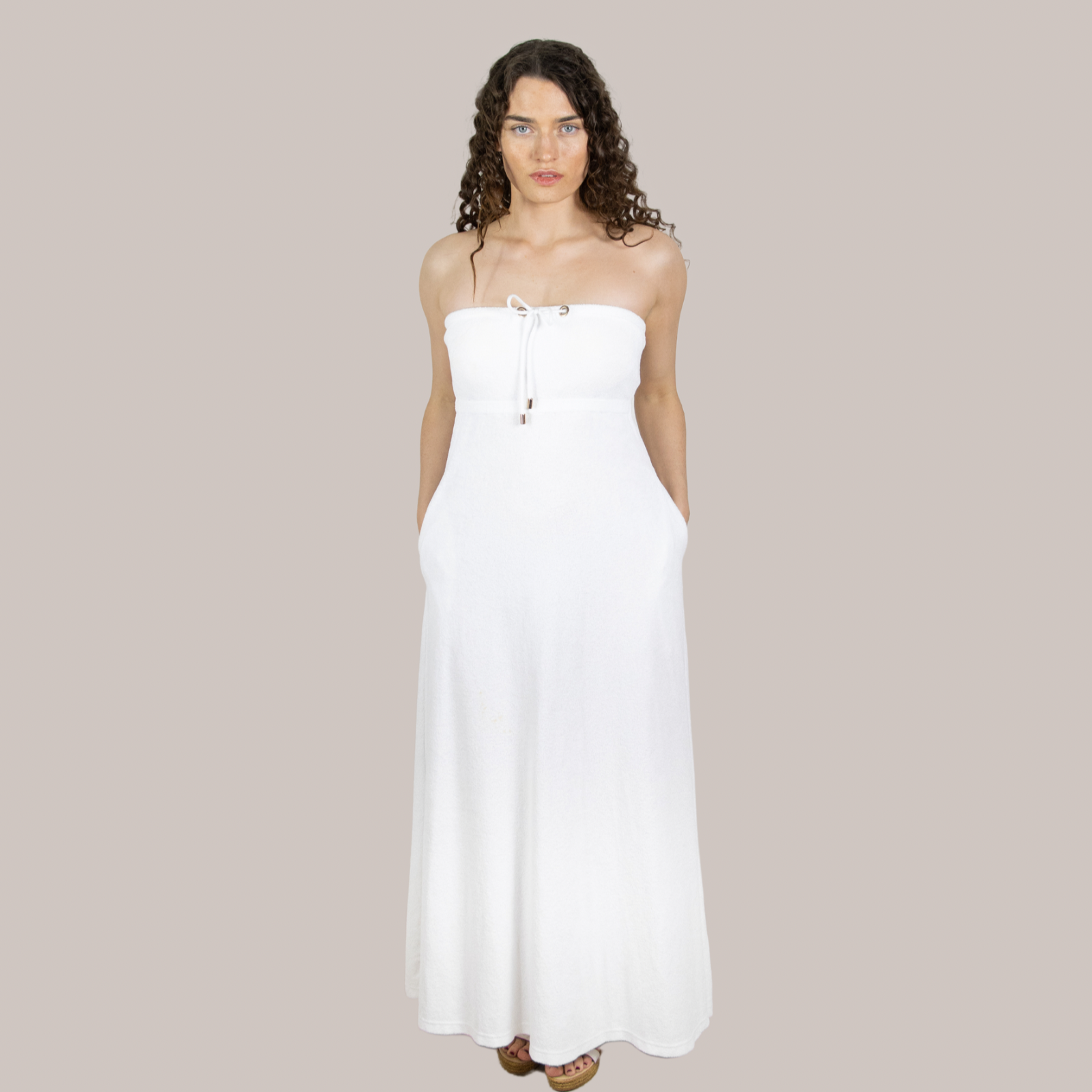 Elegant white long towel dress front view. Soft towelling, quick-drying, and designed for effortless style for maternity, at home, beach, bar or boat.