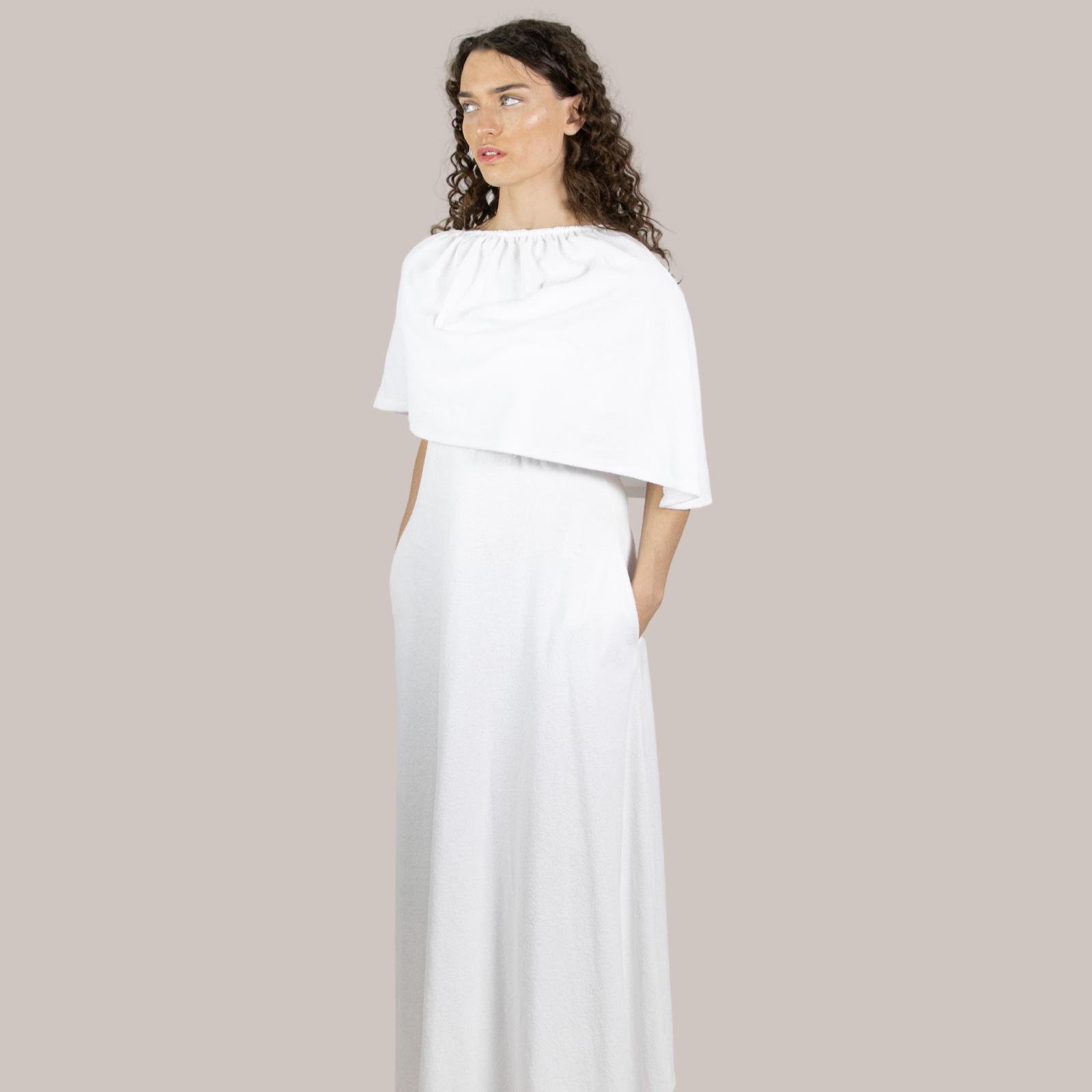 Elegant long white towel dress paired with the short Dry Dolly Poncho have soft towelling, quick-drying, and designed for effortless style at home, beach, bar or boat. Also suitable for maternity.