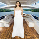 Elegant white long towel dress. Soft towelling, quick-drying, and designed for effortless style for at home, beach, bar or boat. Deep pockets and bust support.