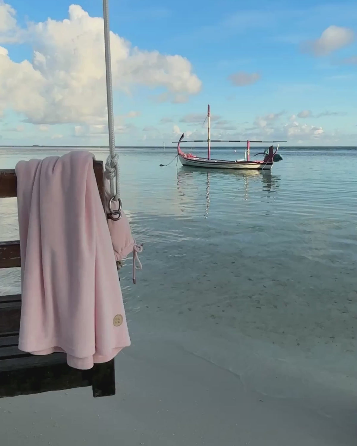 Pink Towel Dress on a swing in the sea